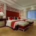 La Beaute De Hanoi Hotel in Hanoi features a neatly made bed, window, seating ottomans and desk