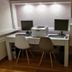 Erato Hotel in Agia Marina room workspace with two desks, chairs, and dual computer monitors