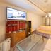 Hotel Mare Takata Maizuru lounge with sofas, glass coffee table, TV, and sliding door to room