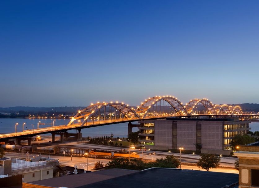 Holiday Inn Rock Island - Quad Cities by IHG with river bridge and city skyline at dusk