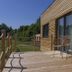 Lakeside Resort Michaela in Alsfeld with wooden terrace and outdoor seating beside a modern cabin
