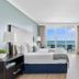 Miami Vacation Rentals - Coconut Grove oceanview bedroom with balcony and floor-to-ceiling windows in Miami
