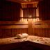 Hôtel Colbert Palace in Antananarivo, wood-paneled spa room with massage tables and candlelight