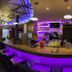 Wohlfühlhotel Schiestl in Fügenberg bar with purple lighting and curved counter