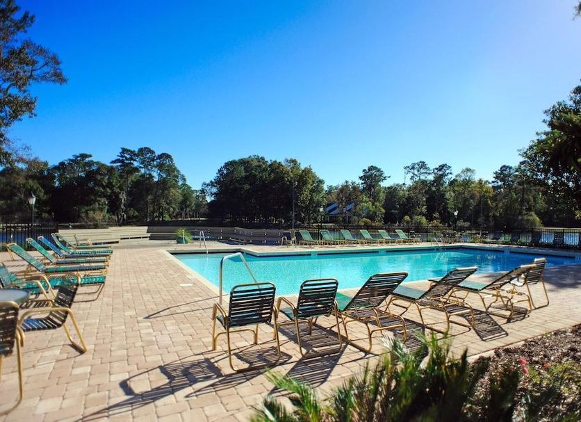 Pawleys Plantation Golf & Country Club in Pawleys Island, outdoor pool with lounge chairs and trees