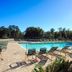 Pawleys Plantation Golf & Country Club in Pawleys Island, outdoor pool with lounge chairs and trees