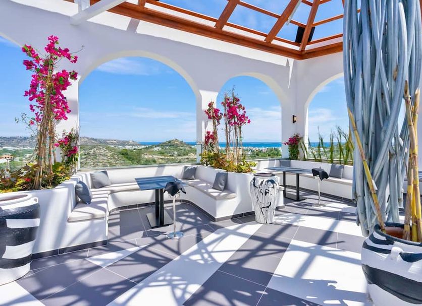 Venezia Resort Hotel & Spa in Faliraki: rooftop lounge with sea views and white seating