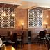 Premier Inn Birmingham City - Waterloo St restaurant seating with brick walls and patterned panels