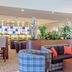 Best Western Macrander Hotel Frankfurt/Kaiserlei lobby lounge with plaid sofas and wooden tables in Offenbach am Main