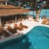 Blue Turtle Hotel Samui in Ko Samui: poolside lounge chairs beside a curving pool overlooking the sea