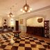 Hotel Monterey Nagasaki lobby with checkered floor, chandeliers, reception desk, and ornate decor in Nagasaki