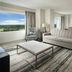 Signia By Hilton Orlando Bonnet Creek suite with large window and green landscape view