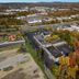 Aerial view of Quality Inn Wayne - Fairfield Area in Wayne with surrounding trees and nearby road