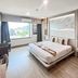 Ruean Phae Royal Park Hotel in Phitsanulok guest room with king bed and large window