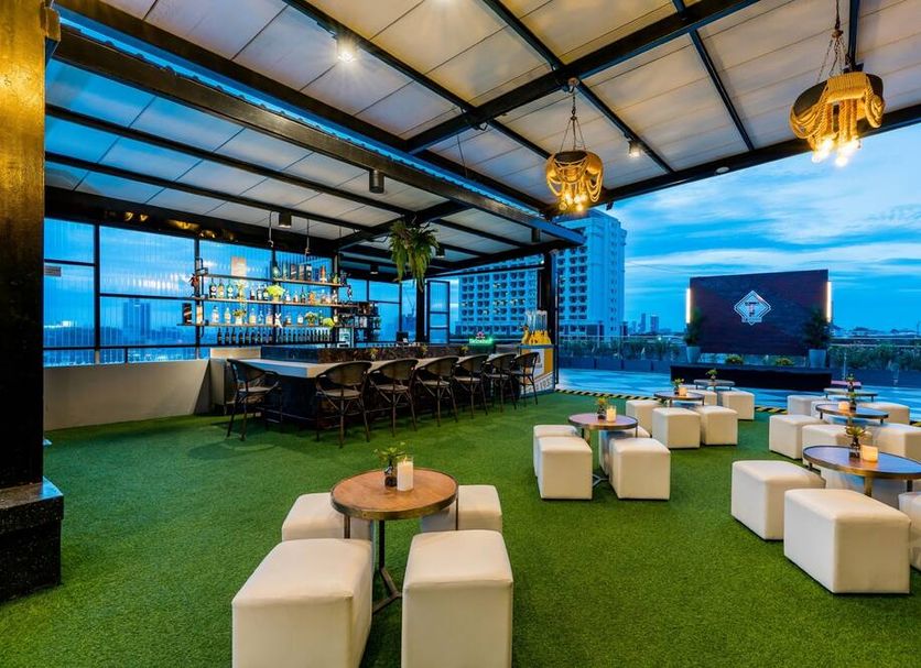 SureStay Plus by Best Western T Pattaya rooftop bar with green turf seating and city views in Chonburi