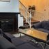 Bridgewater Hotel in Bridgewater lobby with fireplace, sofa seating, glass coffee table and staircase