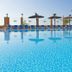 Elba Castillo San Jorge & Antigua Suite Hotel pool with sun loungers and palm trees in Antigua