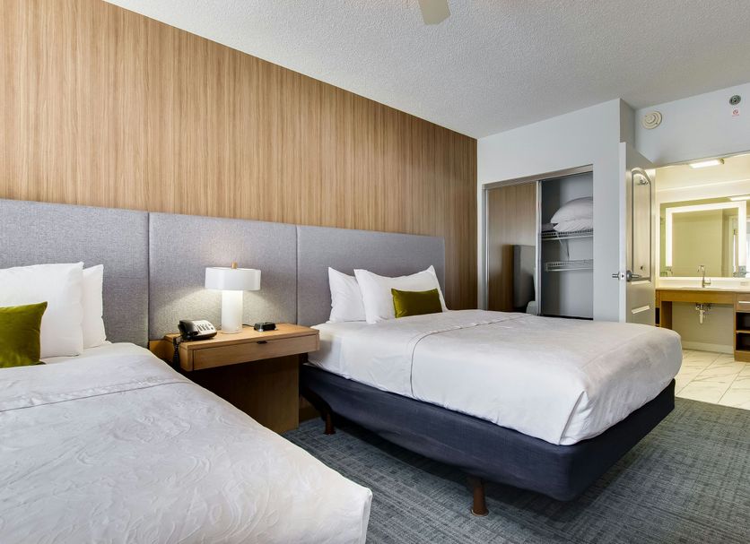 Homewood Suites by Hilton Louisville-East guest room with two beds and bathroom doorway in Louisville