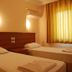 Nur Apart in Marmaris twin guest room with two single beds and curtained window