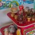 Airport X Managua in Managua: colorful souvenir table with handmade pottery, bowls, and small figurines