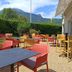 Outdoor terrace seating at Campanile Grenoble Sud - Seyssins with mountain views in Seyssins