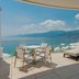 Hilton Rijeka Costabella Beach Resort & Spa terrace with lounge chairs and sea view in Rijeka