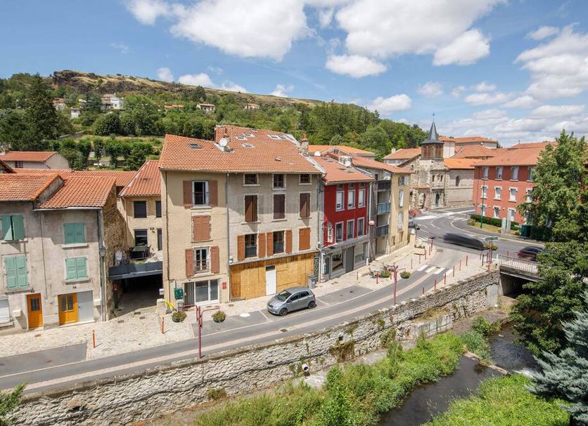 B&B HOTEL Le Puy-En-Velay in Vals-près-le-Puy overlooking riverside buildings and a stone bridge