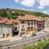 B&B HOTEL Le Puy-En-Velay in Vals-près-le-Puy overlooking riverside buildings and a stone bridge