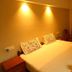 Misty Green Homestay Thekkady guest room with double bed, bedside tables, and window seating