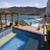 Hotel Bahia Taganga in Taganga with pool, ocean-view terrace, and mountain backdrop