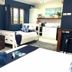Vanuatu Beachfront Apartments, Port Vila: studio apartment with bed, sofa, kitchenette and blue accents