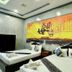 Golden Bakong Boutique, Siem Reap guest room with two beds and Khmer wall art