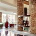 Kampala Serena Hotel in Kampala lobby with stone columns, seating area, and decorative fireplace