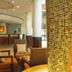 Garden Court Eastgate lobby seating area with mosaic column in Johannesburg