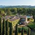 Agriturismo La Sovana in Sarteano with ivy-covered villa, cypress trees, pool and mountain views