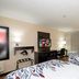 Red Roof Inn Raleigh Southwest - Cary guest room with two beds, TV, desk and beige decor