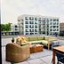 Rooftop terrace at The Junto in Columbus with lounge seating and city views