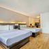 Studio 6 San Antonio, Tx - Medical Center room with two beds and wall-mounted TV in San Antonio