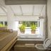 Felissimo Exclusive Hotel bathroom with soaking tub, double sink vanity and balcony greenery in Balneário Camboriú