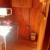 Wood House Pattaya in Pattaya kitchen nook with sink, microwave and wooden paneling