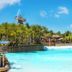 Holiday Inn Orlando-Disney Springs Area By IHG in Lake Buena Vista, tropical lagoon-style pool with palm trees