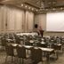 Euro Park Otel Istanbul conference room with rows of chairs, tables, projector screen and stage