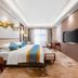 Anhui Construction New Era Hotel in Bengbu guest room with king bed, wall-mounted TV and window seating