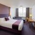Premier Inn Belfast Titanic Quarter room with double bed, desk, window seating and city view