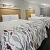 Red Roof Inn Greensboro Airport in Greensboro: two double beds in a guest room with wood accents