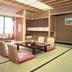 Hotel Biwanso in Nanao tatami room with low table, floor cushions, and large window