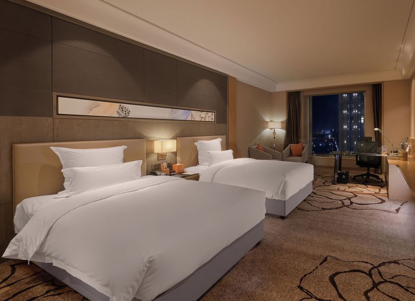 Pullman Shishi Mattison in Quanzhou twin-bed guest room with city view and desk