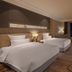 Pullman Shishi Mattison in Quanzhou twin-bed guest room with city view and desk