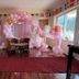 The Sparkling Turtle Backpackers Hostel in Kathmandu: pink balloon-decorated event room with table and chairs