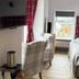 St Olaf Golf Hotel, Peterhead: cozy guest room with twin beds, plaid chairs, wall TV and window
